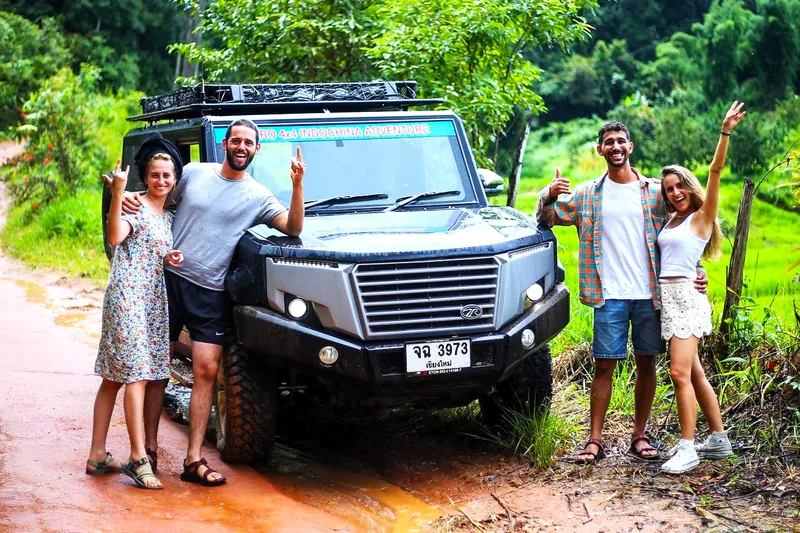 Travelers with WIRO 4x4 vehicle on jungle road in Chiang Mai